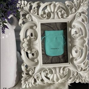 White decorative frame with authentic Tiffany & Co sachet in Tiffany blue.